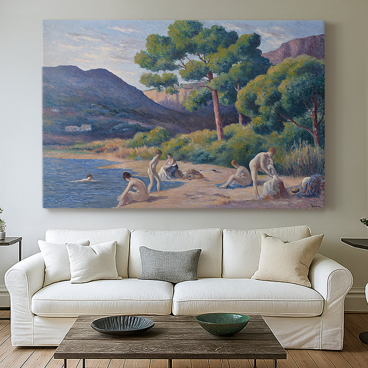 Canvas art print detailing a seaside scene with bathers, centered above a sofa as a large focal wall piece