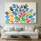 Canvas art print detailing a stylized collage resembling leaves, centered above a sofa as a large focal wall piece