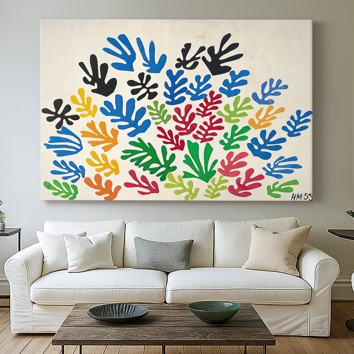 Canvas art print detailing a stylized collage resembling leaves, centered above a sofa as a large focal wall piece