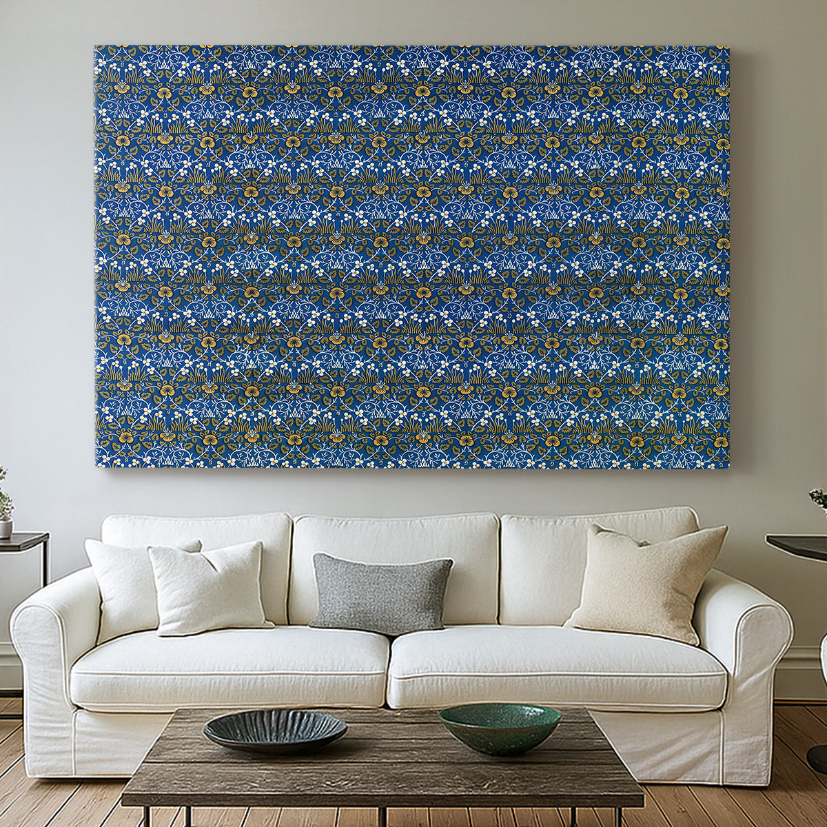 Canvas art print detailing a textile-style surface filled with small leaves and blossoms, centered above a sofa as a large focal wall piece