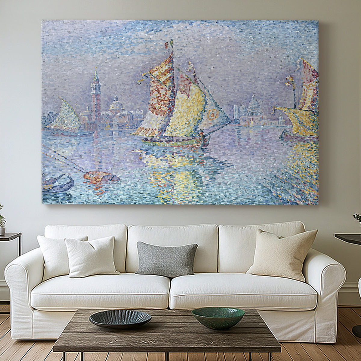 Canvas art print detailing a maritime view with sailboat, centered above a sofa as a large focal wall piece