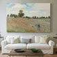 Canvas art print detailing a rural landscape with scattered figures among blooming flowers, centered above a sofa as a large focal wall piece
