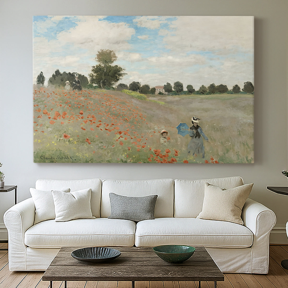 Canvas art print detailing a rural landscape with scattered figures among blooming flowers, centered above a sofa as a large focal wall piece
