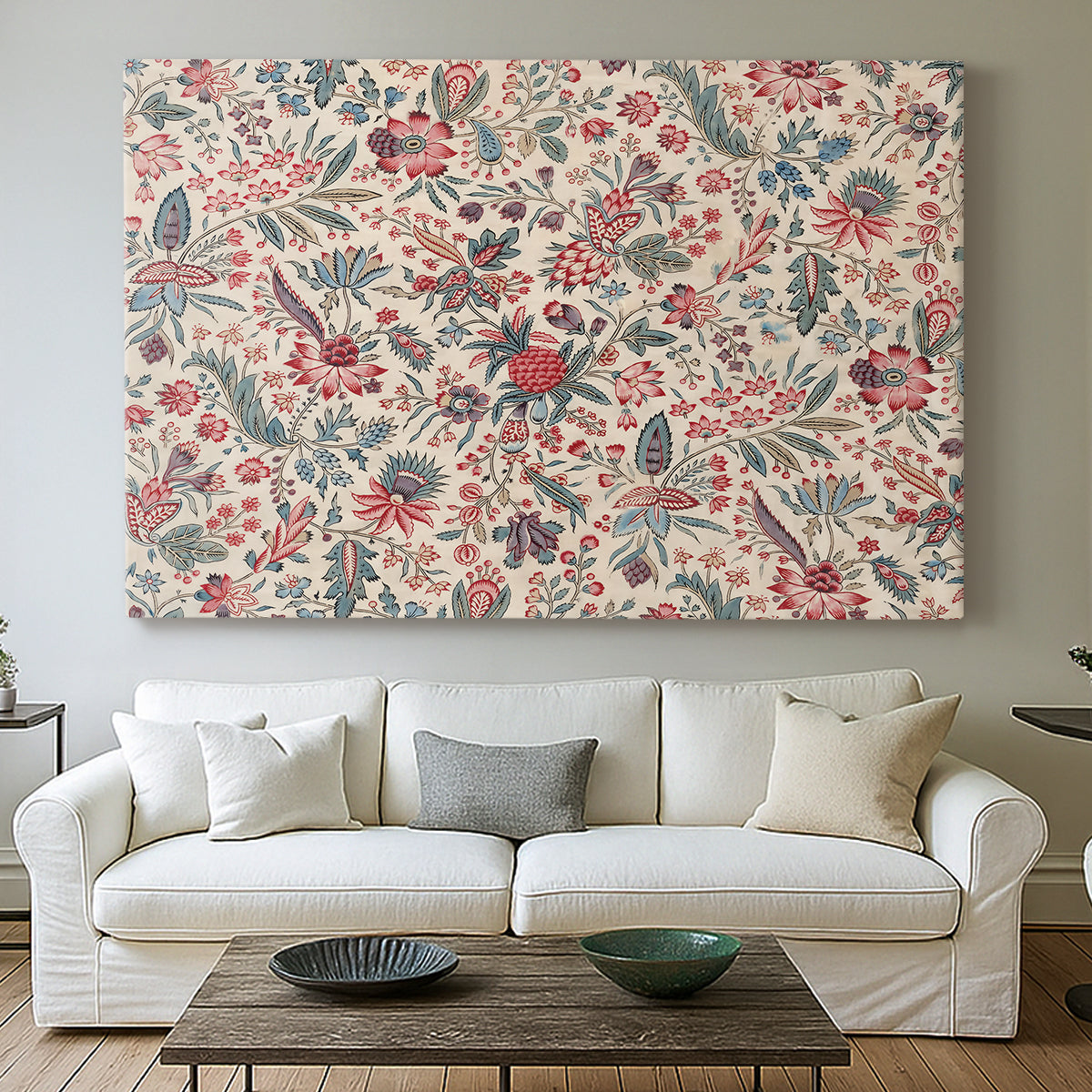 Canvas art print detailing a textile-style artwork with repeating botanical motifs, centered above a sofa as a large focal wall piece