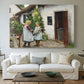 Canvas art print detailing a farmhouse exterior with figures engaged in everyday moment, centered above a sofa as a large focal wall piece
