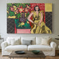 Canvas art print detailing a stylized composition of a woman next to a flower vase, centered above a sofa as a large focal wall piece