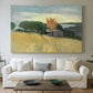 Canvas art print detailing a landscape of ripened wheat in an open natural setting, centered above a sofa as a large focal wall piece