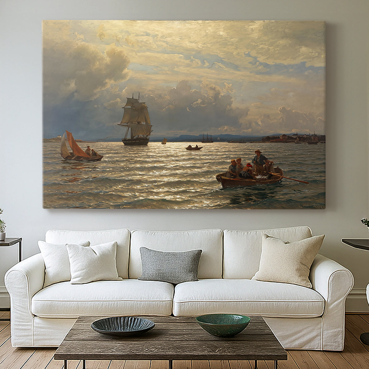 Canvas art print detailing a scenic waterfront view with gentle sky and shoreline, centered above a sofa as a large focal wall piece