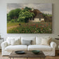 Canvas art print detailing a peaceful farmhouse view with natural vegetation, centered above a sofa as a large focal wall piece