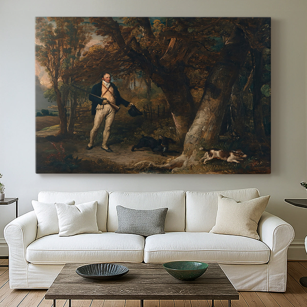 Canvas art print detailing a detailed outdoor scene of man with dogs, centered above a sofa as a large focal wall piece