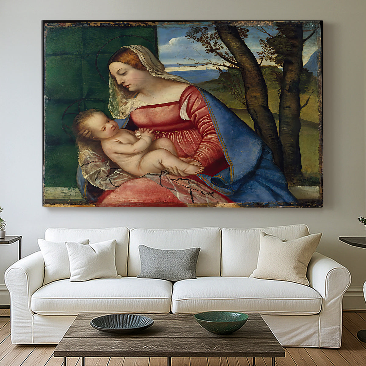 Canvas art print detailing a sacred figure study with child held against dark background, centered above a sofa as a large focal wall piece