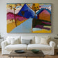 Canvas art print detailing a stylized street perspective with geometric simplification, centered above a sofa as a large focal wall piece