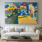 Canvas art print detailing a countryside street view with houses and greenery in vibrant tones, centered above a sofa as a large focal wall piece