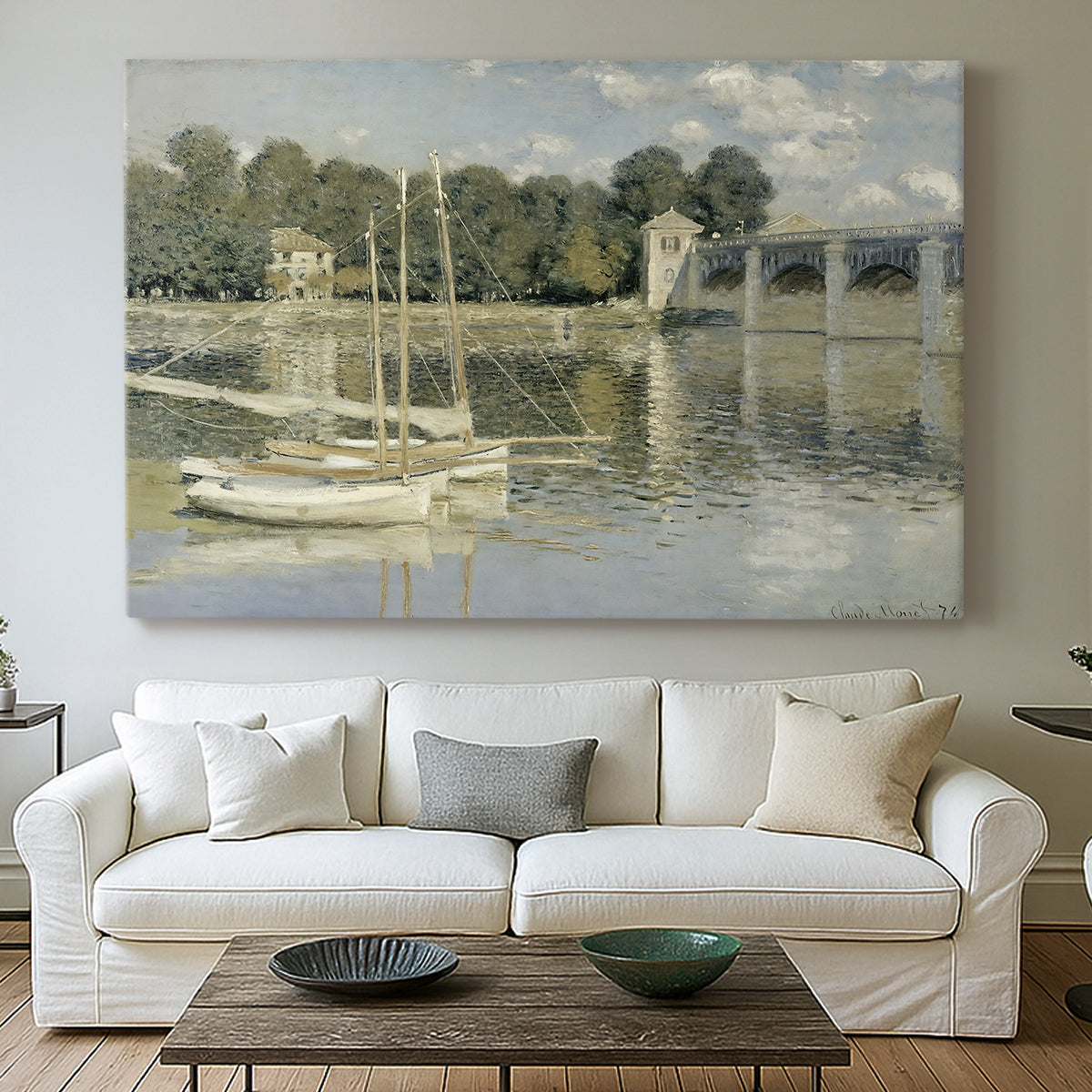 Canvas art print detailing a riverside view with architecture and nautical activity, centered above a sofa as a large focal wall piece