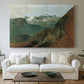 Canvas art print detailing a rugged terrain view, centered above a sofa as a large focal wall piece