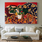Canvas art print detailing a stylized composition of fruit and tableware, centered above a sofa as a large focal wall piece