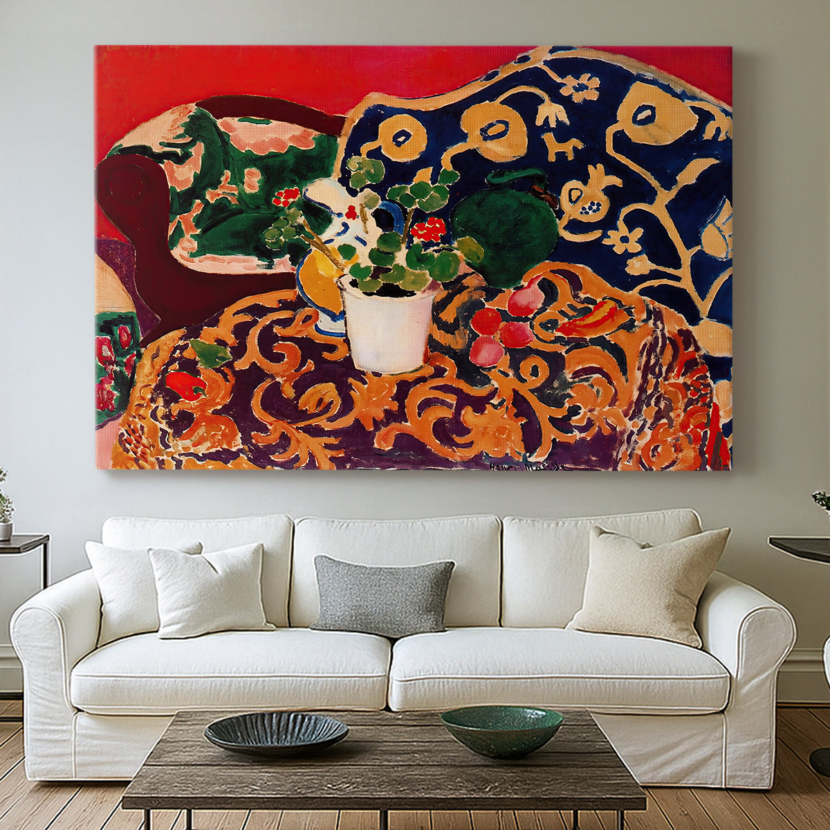 Canvas art print detailing a stylized composition of fruit and tableware, centered above a sofa as a large focal wall piece
