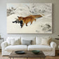Canvas art print detailing a dynamic depiction of animal in cold snowy environment, centered above a sofa as a large focal wall piece