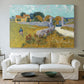 Canvas art print detailing a landscape centered on structure within bright field, centered above a sofa as a large focal wall piece