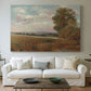 Canvas art print detailing an atmospheric landscape with depth, centered above a sofa as a large focal wall piece