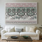 Canvas art print detailing a textile-style design with repeating curved and linear shapes, centered above a sofa as a large focal wall piece