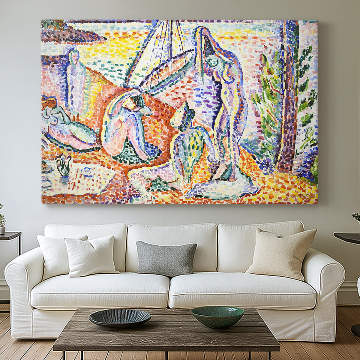 Canvas art print detailing a stylized outdoor composition of figures by the coast, centered above a sofa as a large focal wall piece