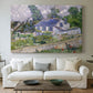 Canvas art print detailing a stylized composition featuring houses and landscape, centered above a sofa as a large focal wall piece