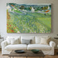 Canvas art print detailing a stylized vineyard landscape with depth, centered above a sofa as a large focal wall piece