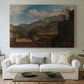 Canvas art print detailing a scenic mountain setting, centered above a sofa as a large focal wall piece