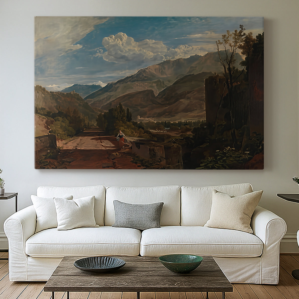 Canvas art print detailing a scenic mountain setting, centered above a sofa as a large focal wall piece