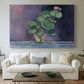 Canvas art print detailing a simple still life featuring a potted geranium, centered above a sofa as a large focal wall piece