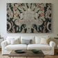 Canvas art print detailing a decorative fabric pattern with mixed botanical and animal forms, centered above a sofa as a large focal wall piece
