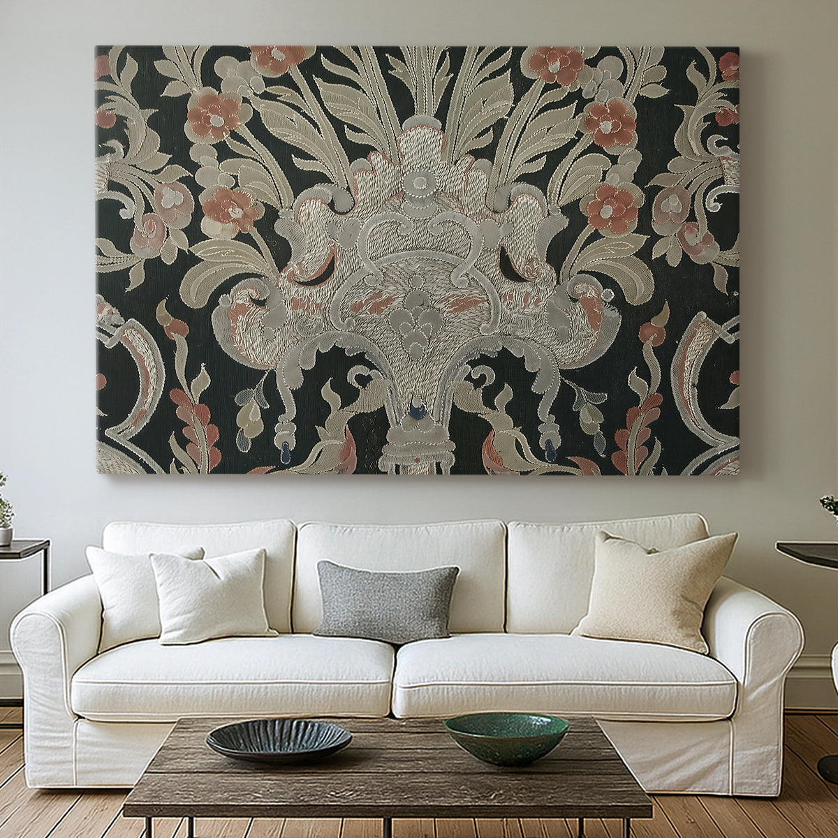 Canvas art print detailing a decorative fabric pattern with mixed botanical and animal forms, centered above a sofa as a large focal wall piece