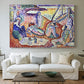 Canvas art print detailing a Fauvist coastal gathering with bright broken color, centered above a sofa as a large focal wall piece