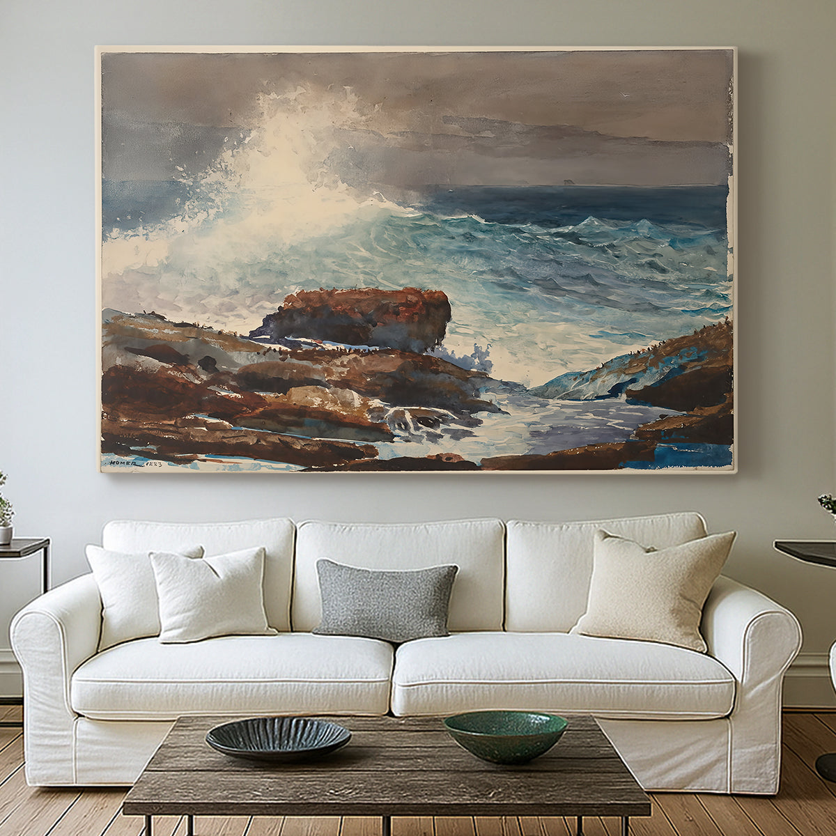 Canvas art print detailing a shoreline view with surf and coastal elements, centered above a sofa as a large focal wall piece
