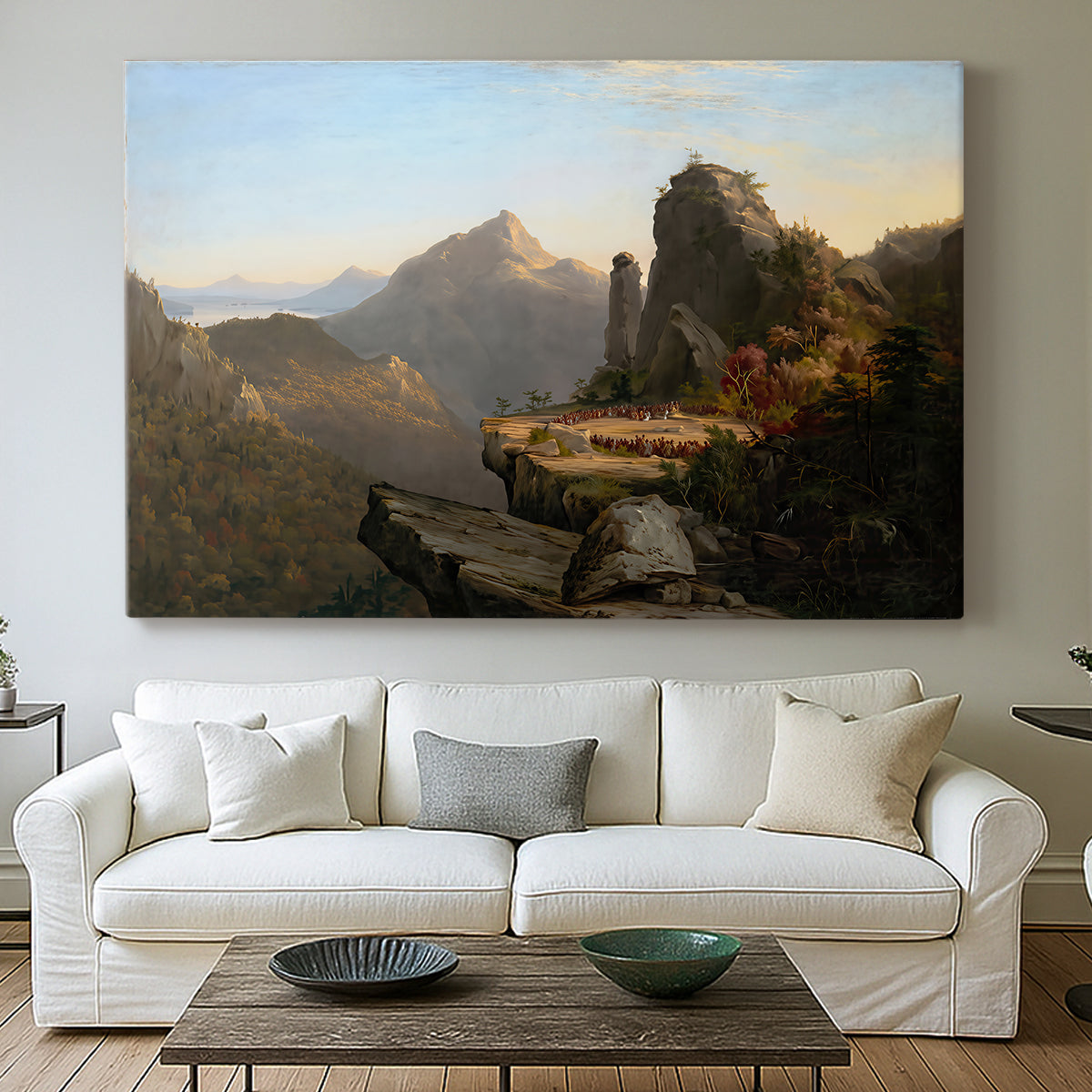 Canvas art print detailing a narrative outdoor scene set in a mountainous river valley, centered above a sofa as a large focal wall piece