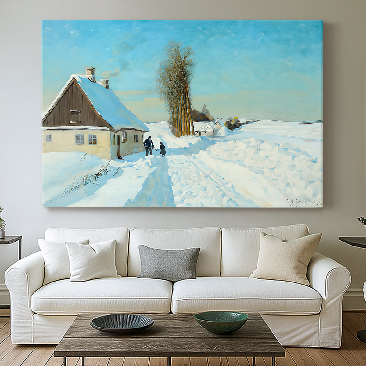 Canvas art print detailing a rural home setting with snow-covered ground and activity, centered above a sofa as a large focal wall piece
