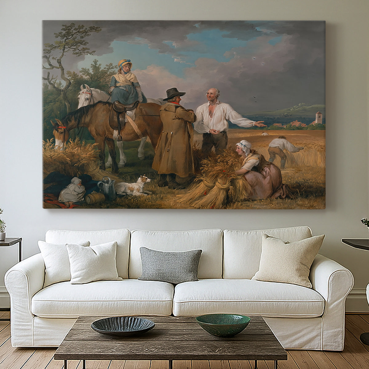 Canvas art print detailing a rural landscape showing agricultural labor, centered above a sofa as a large focal wall piece