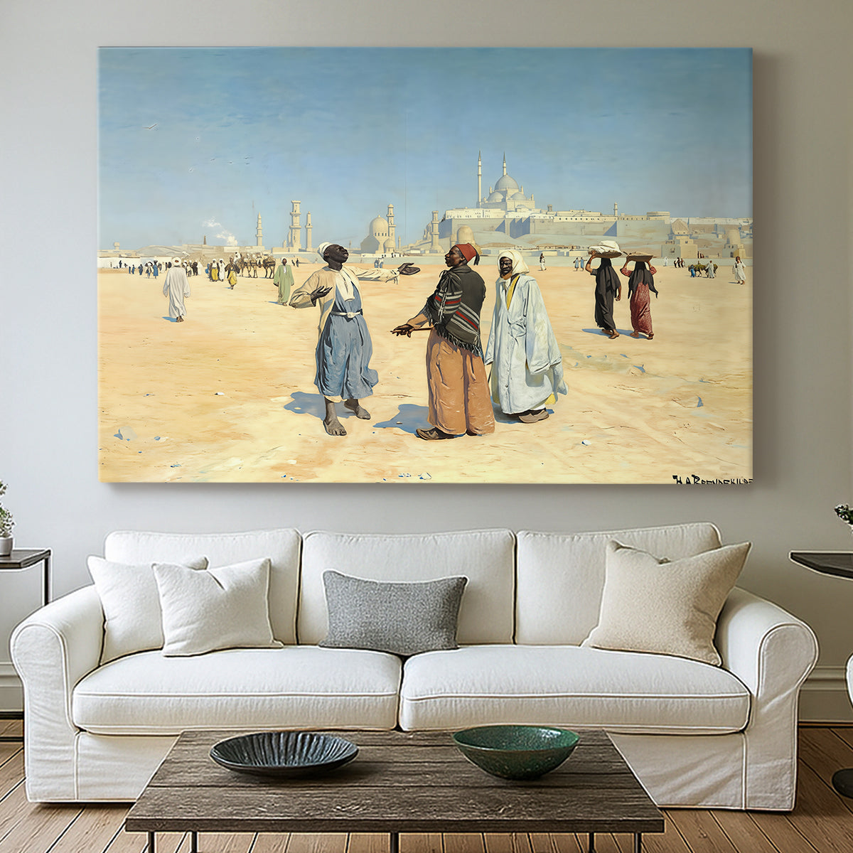 Canvas art print detailing a cultural landscape with desert foreground and historic structures, centered above a sofa as a large focal wall piece