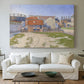 Canvas art print detailing an urban composition with structures, centered above a sofa as a large focal wall piece
