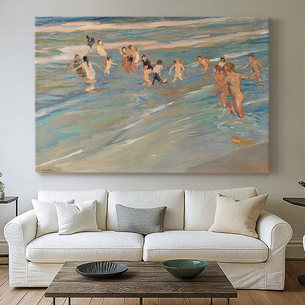 Canvas art print detailing a coastal scene with children and reflective shoreline, centered above a sofa as a large focal wall piece
