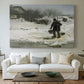 Canvas art print detailing an atmospheric winter landscape with human presence, centered above a sofa as a large focal wall piece