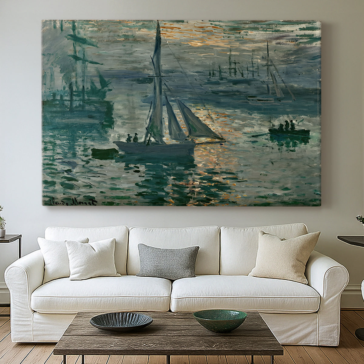 Canvas art print detailing an atmospheric ocean view with sun rising through haze, centered above a sofa as a large focal wall piece
