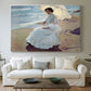 Canvas art print detailing a serene beach scene with single figure and soft light, centered above a sofa as a large focal wall piece