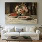 Canvas art print detailing a detailed arrangement of food and beverage items, centered above a sofa as a large focal wall piece