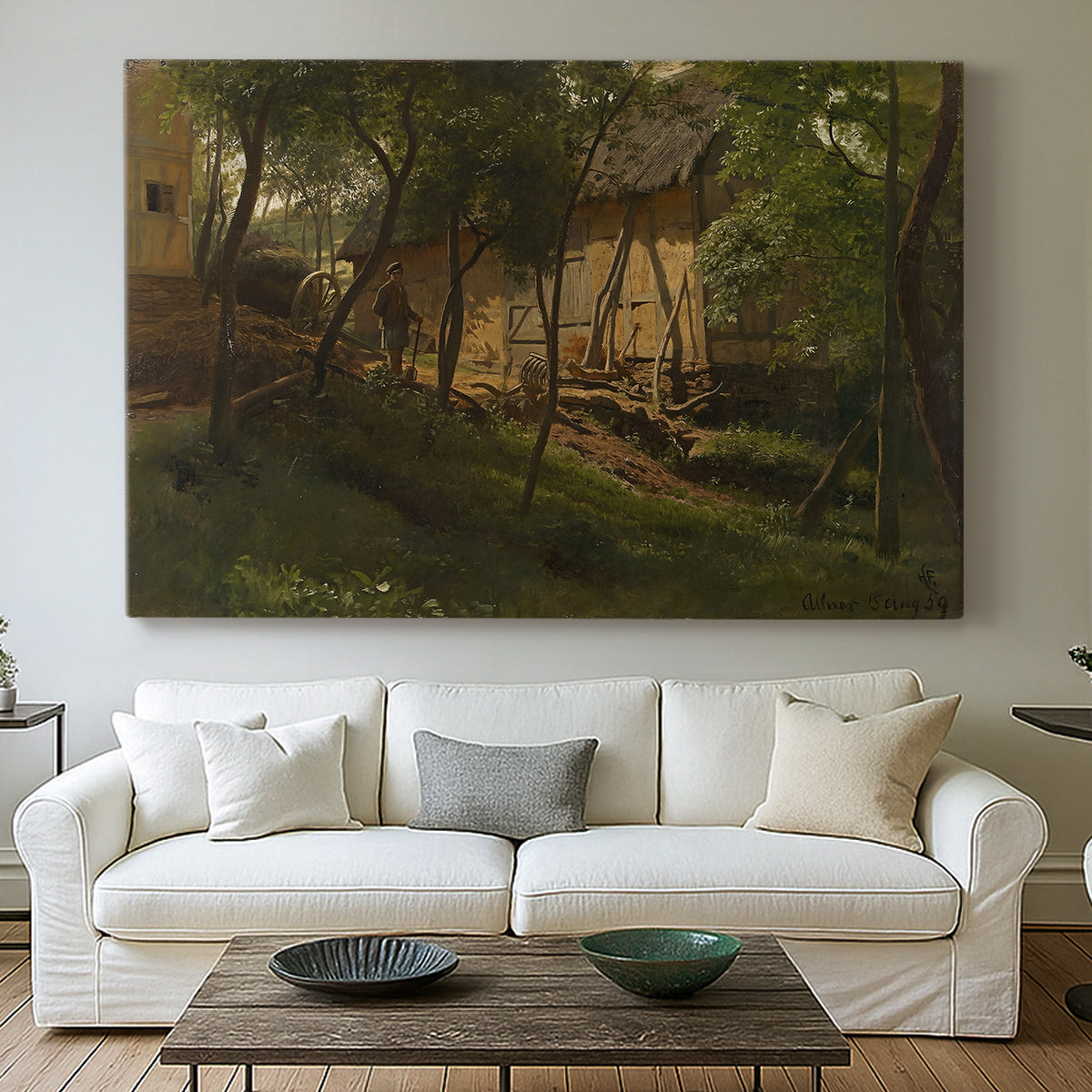 Canvas art print detailing a rural composition with buildings nestled among greenery, centered above a sofa as a large focal wall piece