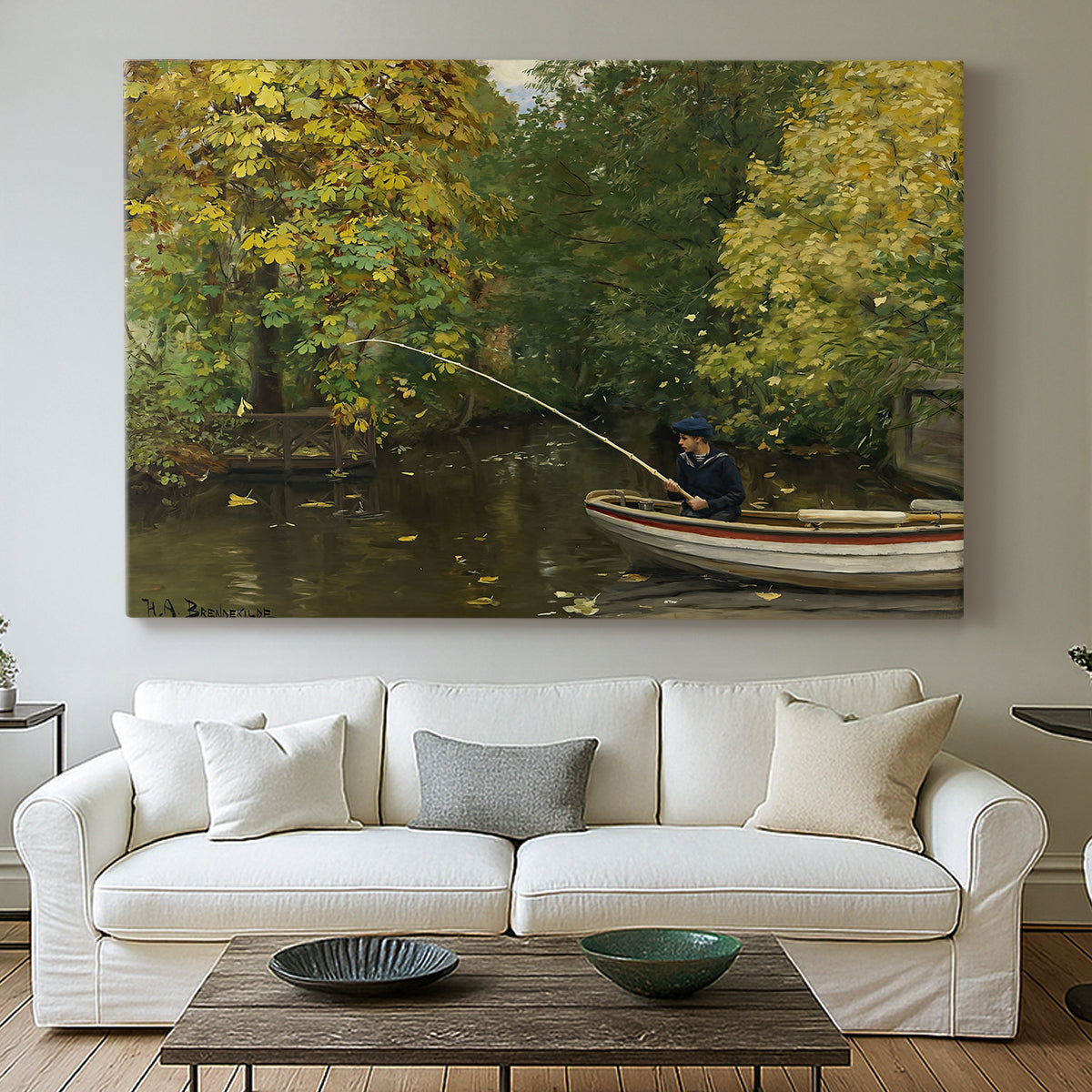 Canvas art print detailing a tranquil nature setting with lone figure by water, centered above a sofa as a large focal wall piece