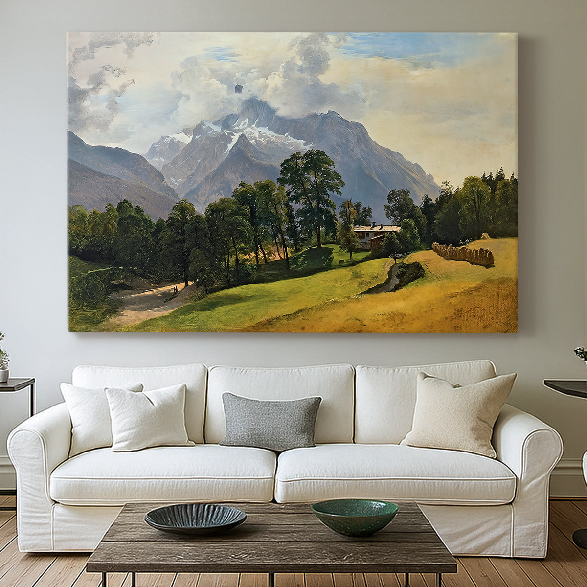 Canvas art print detailing a scenic alpine view with open sky, centered above a sofa as a large focal wall piece