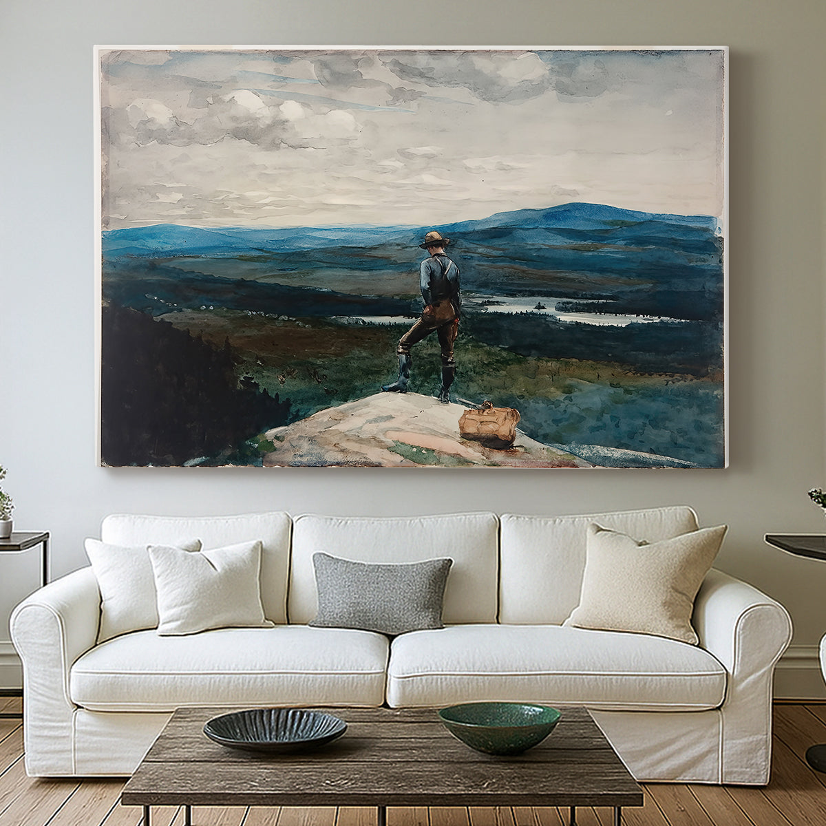 Canvas art print detailing a quiet lake scene with lone person and open horizon, centered above a sofa as a large focal wall piece
