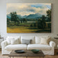 Canvas art print detailing a countryside view with soft atmospheric perspective, centered above a sofa as a large focal wall piece